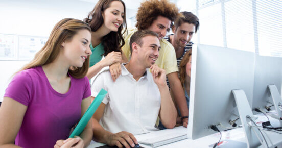 smiling students computer class 4