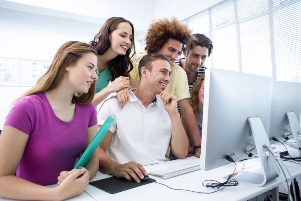 smiling students computer class 4